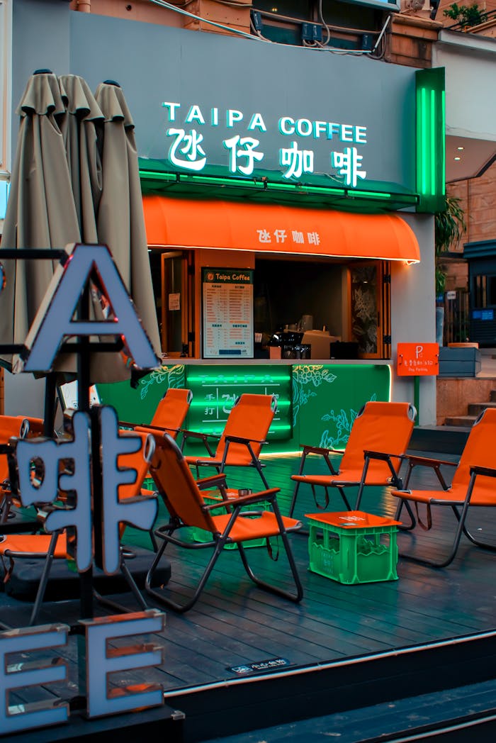 Crafting Captivating Headlines: Your awesome post title goes here Colorful outdoor cafe with neon lights and orange chairs.