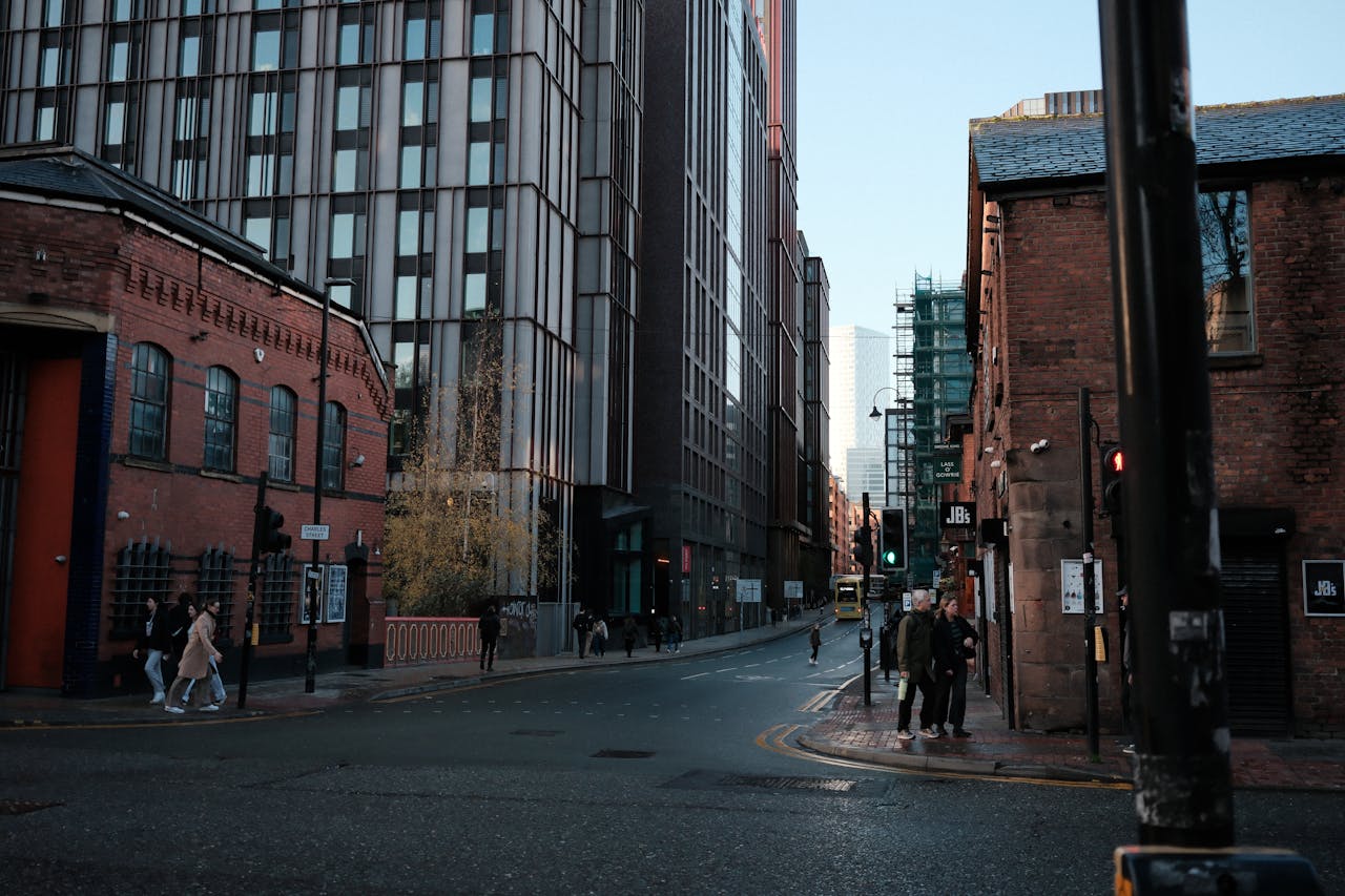 Home Street view showcasing a blend of historic and modern architecture with pedestrians.